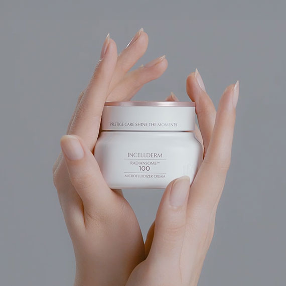 Hands holding a Korean cosmetic product